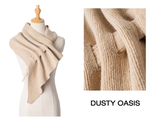 Detailed close-up of Dusty Oasis knit scarf showing ribbed texture and hollow-out eyelets