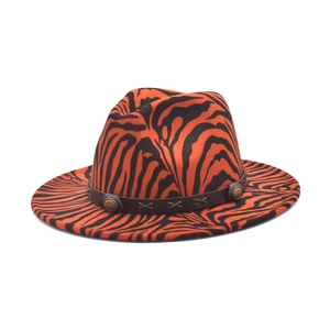 Detailed view of the tiger print felt hat with leather band and vintage metal concho