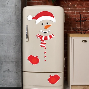 Festive snowman magnetic stickers set on a vintage fridge for Christmas home decoration