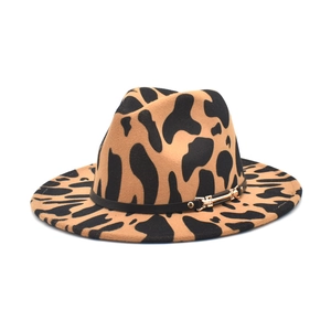 Detailed view of the leopard print fedora with black leather band and gold buckle