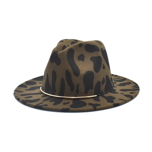 Detailed side view of an olive green leopard print wool fedora with a gold metal band