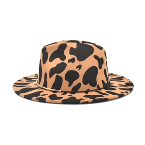 Detail of the animal cow print pattern and thin gold band on the wide brim fedora hat
