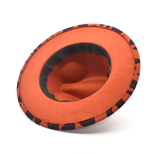 Detail of orange wool fedora featuring contrasting leopard print on the inner brim