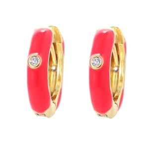 Detail of red enamel U-shaped hoop earrings with gold plating and sparkling zircon stone