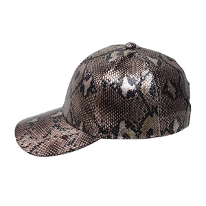 Close-up of metallic snakeskin texture and scales on a vintage bronze baseball cap