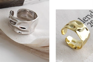 Detailed macro view showing the 925S hallmark on irregular concave convex textured rings