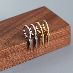 Close-up of S925 sterling silver hoop earrings with zircon pavé and long spike pendants