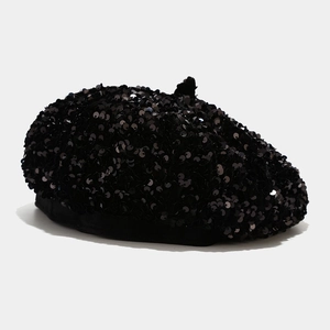 Detailed close-up showing the dense black sequin embroidery on this stylish beret hat