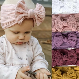 Soft jacquard nylon baby headbands with large bows in various colors for infant girls