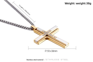 Detail view of 50x38mm two-tone stainless steel cross pendant with zircon on 660mm box chain