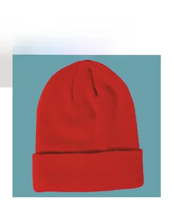 Detail view of the red ribbed knit beanie showing thick texture and classic folded cuff design