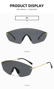 Detail of grey shield sunglasses with gold metal temples and modern frameless design