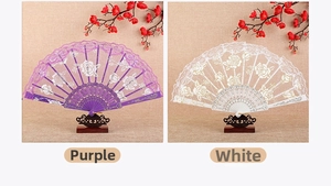 Detail view of purple and white lace folding fans with rose patterns on display stands
