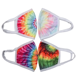 Detail of four colorful tie-dye ear-loop face masks made of soft fabric with white elastic