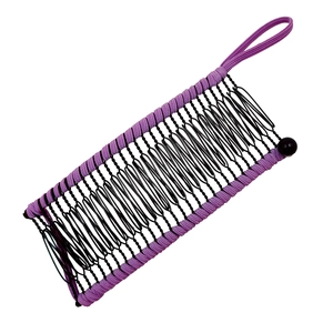 Detail view of purple banana hair clip with black metal wire comb teeth and elastic band