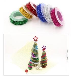 Detail of multi-color metallic tinsel garland rolls for Christmas tree DIY decorations