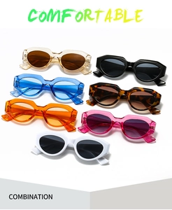 Collection of oversized geometric sunglasses in seven assorted colors on white background