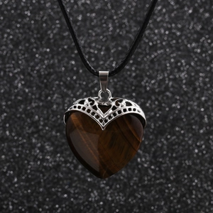 Tiger eye heart pendant necklace with silver metal filigree on a black wax rope chain