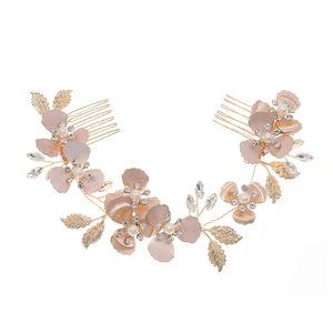 Elegant gold bridal hair comb with pink floral accents, pearls and crystal leaves