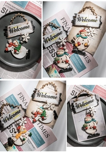 Detail of Christmas snowman welcome door sign with festive colored scarves and wood texture