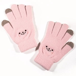 Detail of pink knitted winter gloves featuring cute bear embroidery and touchscreen tips