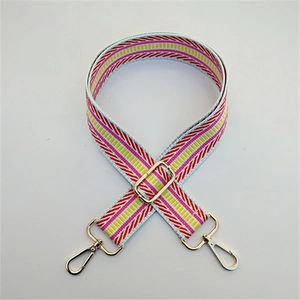 Close-up of pink and yellow striped adjustable shoulder strap with gold swivel hooks