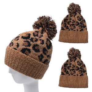 Women's winter leopard print knit beanie with fuzzy pom-pom and warm ribbed cuff