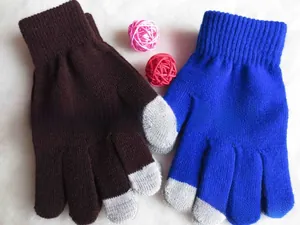 Close-up of winter knitted touchscreen gloves in dark brown and royal blue colors