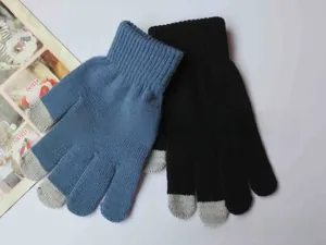 Detail of navy blue and black winter knit gloves with touch screen fingertip patches