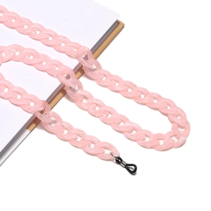 Detail of pink acrylic chain links and black rubber connector for eyeglass cord