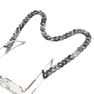 Detail of grey marble acrylic eyeglass chain with large links and gold metal connectors