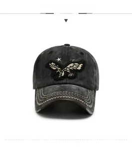 Detail of vintage washed grey baseball cap with eagle embroidery and star accents