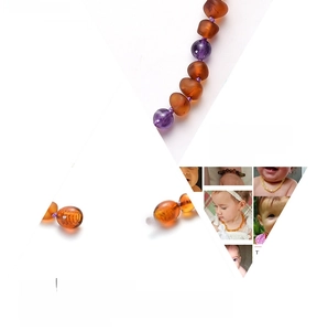 Macro view of Baltic amber beads with amethyst and safe screw clasp for baby necklace