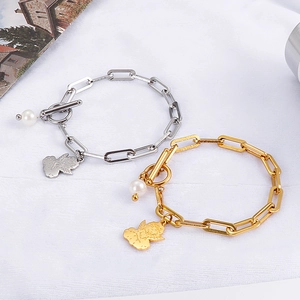 Gold and silver angel charm bracelets with pearls and paperclip chain link design
