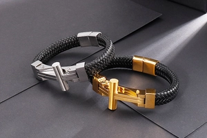 Detail of men's woven leather bracelets with silver and gold stainless steel clasps