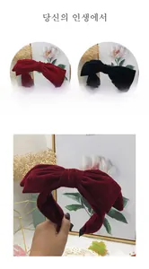 Detail of elegant velvet double-layered bow headbands in rich burgundy and classic black
