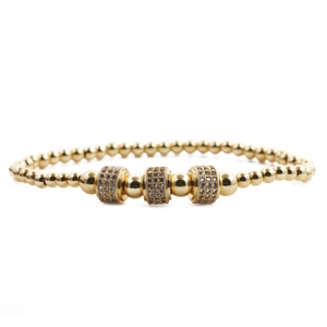 Men's gold beaded crown bracelet set with micro-pave crystals on cylindrical spacers