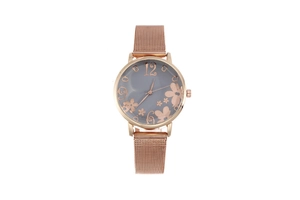 Macro detail of rose gold mesh strap watch with elegant flower and butterfly dial design