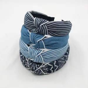 Detailed view of blue denim fabric headbands with stripe and geometric patterns