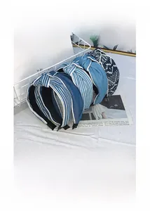 Detailed view of blue denim fabric headbands with stripe and geometric patterns