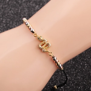 Detail of snake charm bracelet with pave crystals and adjustable tricolor bead chain