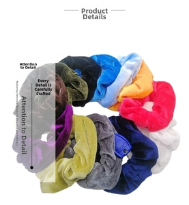 Close-up of twelve colorful velvet scrunchies with soft texture and hidden zipper pocket