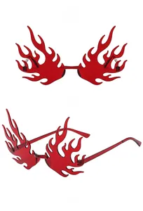 Macro detail of red flame-shaped rimless sunglasses with slim metal temples and vibrant lenses