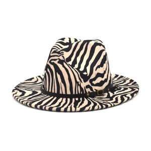 Detail of zebra pattern wool fedora hat featuring a black leather band and gold buckle