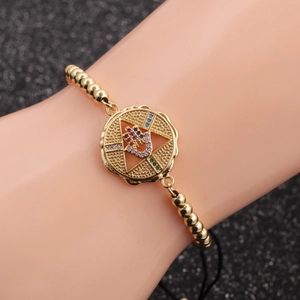 Bohemian gold beaded bracelet with Hamsa Hand and star charm set with colorful zircons