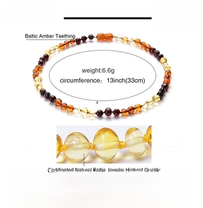 Detailed view of 33cm multicolor Baltic amber beads necklace for babies with secure knots