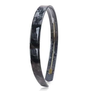 Detailed view of 1.5cm acetate headband with grey marble texture and inner metal reinforcement
