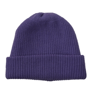 Macro detail of dark purple rib-knit beanie showing thick double-layer wool texture