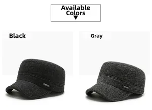 Detail view of winter flat top caps in black and grey with sport metal emblem decoration