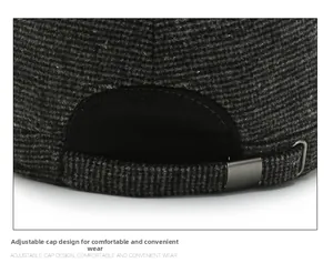 Detail of adjustable metal buckle and grey plaid fabric on a men's flat cap